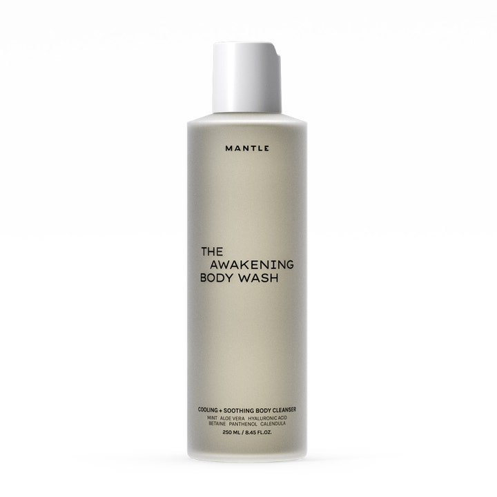 Mantle The Awakening Body Wash 250 ml viilentävä suihkugeeli tyylikkäässä harmaassa pullossa valkoisella korkilla.