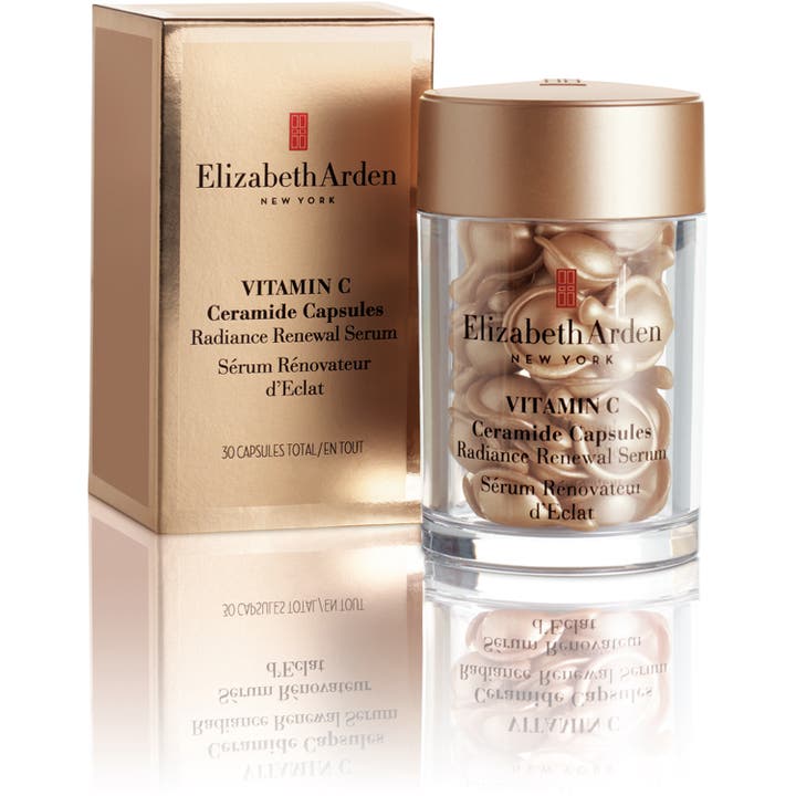 Elizabeth Arden Ceramide Capsules Vitamin C 30 kpl kirkastava seerumi kultaisessa pakkauksessa ja purkissa.