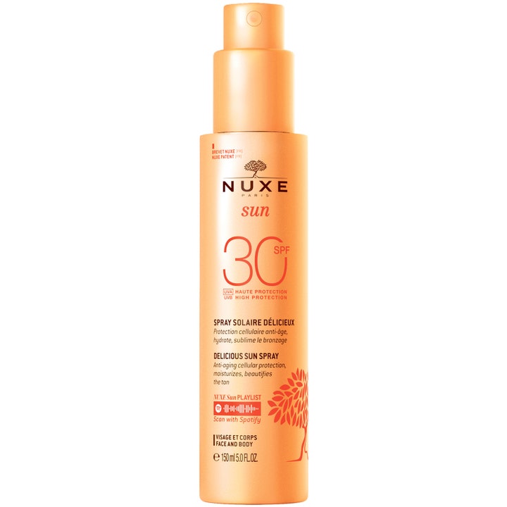 Nuxe Sun Delicious Sun Spray SPF 30 150 ml suojaava ja kosteuttava aurinkosuihke oranssissa pumppupullossa.