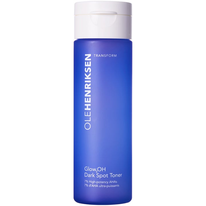 Ole Henriksen Glow2OH Dark Spot Toner 190 ml AHA-kasvovesi vähentää tummia läiskiä sinisessä mattapintaisessa pullossa.