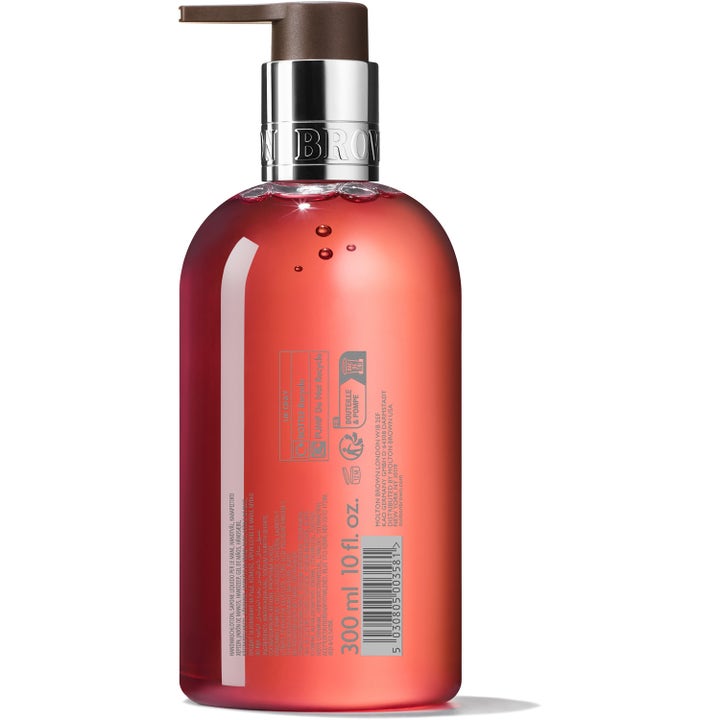 Molton Brown Heavenly Gingerlily 300 ml puhdistava käsisaippua pullon takapuoli ja korallinvärinen neste