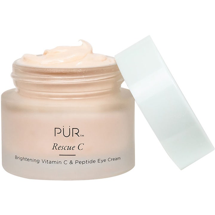 PÜR Rescue C Brightening Vitamin C & Peptide Eye Cream 15 ml silmänympärysvoide, jossa on persikkainen koostumus huurretussa lasipurkissa.