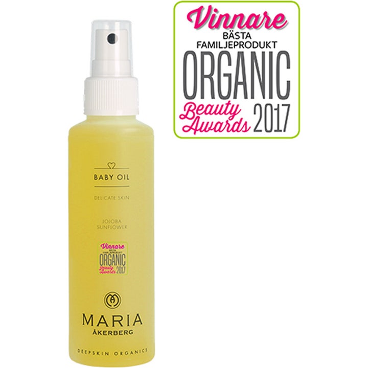 Maria Åkerberg Baby Oil 125 ml hoitava vauvaöljy jojoballa keltaisessa suihkepullossa, jossa on valkoinen korkki.