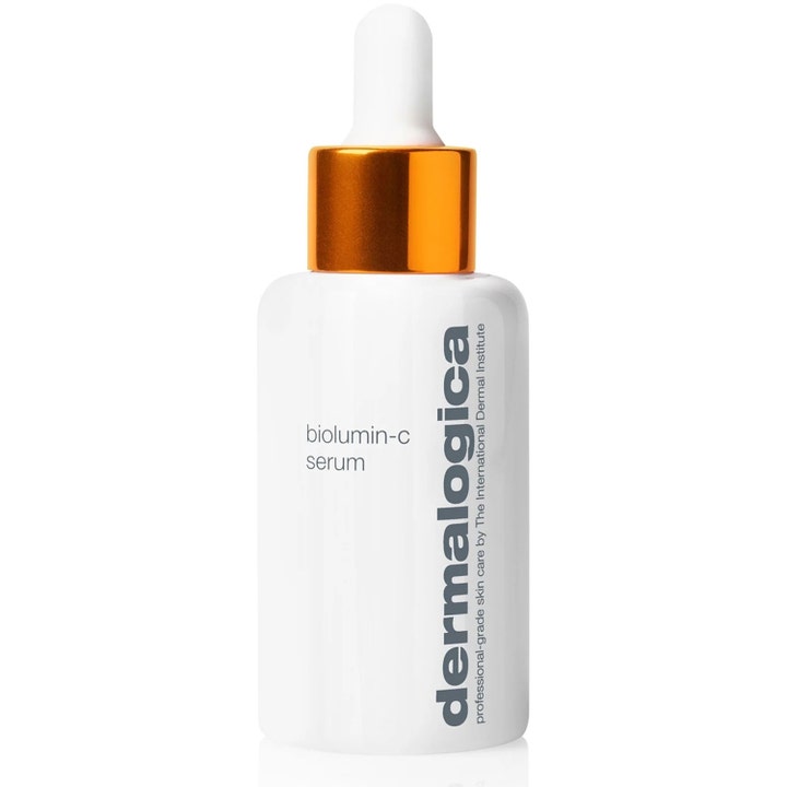 Dermalogica BioLumin-C Serum kirkastava C-vitamiiniseerumi valkoisessa pipettipullossa oranssilla korkilla.