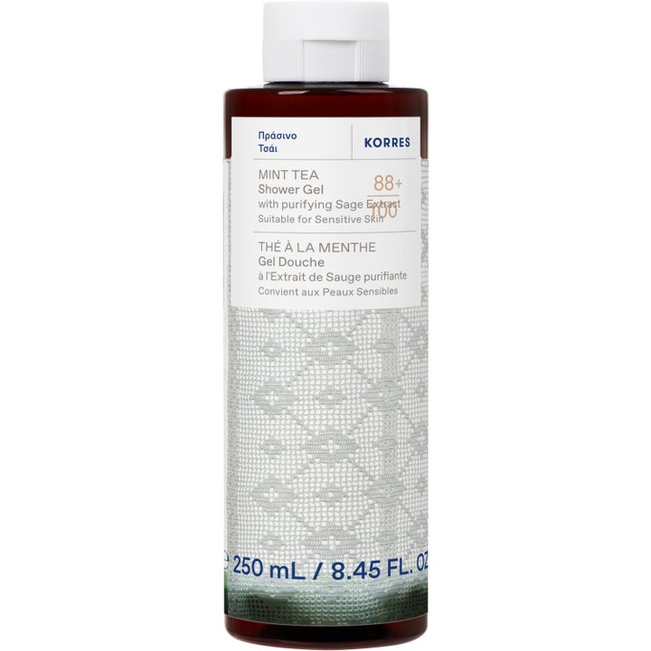 Korres Mint Tea Shower Gel 250 ml puhdistava suihkugeeli ruskeassa pullossa valkoisella pitsikuviolla.