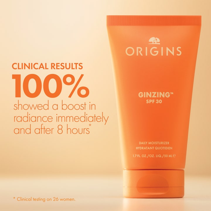 Origins Ginzing SPF30 Daily Moisturizer 50 ml heleyttävä aurinkovoide ja teksti 100 % lisätystä säteilystä