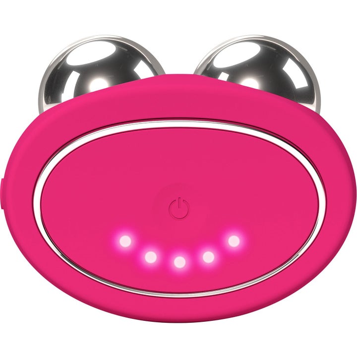 FOREO BEAR 2 Fuchsia kasvojen mikrovirtalaite on kirkkaan vaaleanpunainen ja siinä on kaksi metallista palloa.