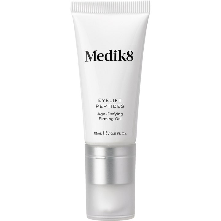 Medik8 Eyelift Peptides 15 ml kiinteyttävä silmänympärysgeeli valkoisessa tuubissa hopeisella korkilla