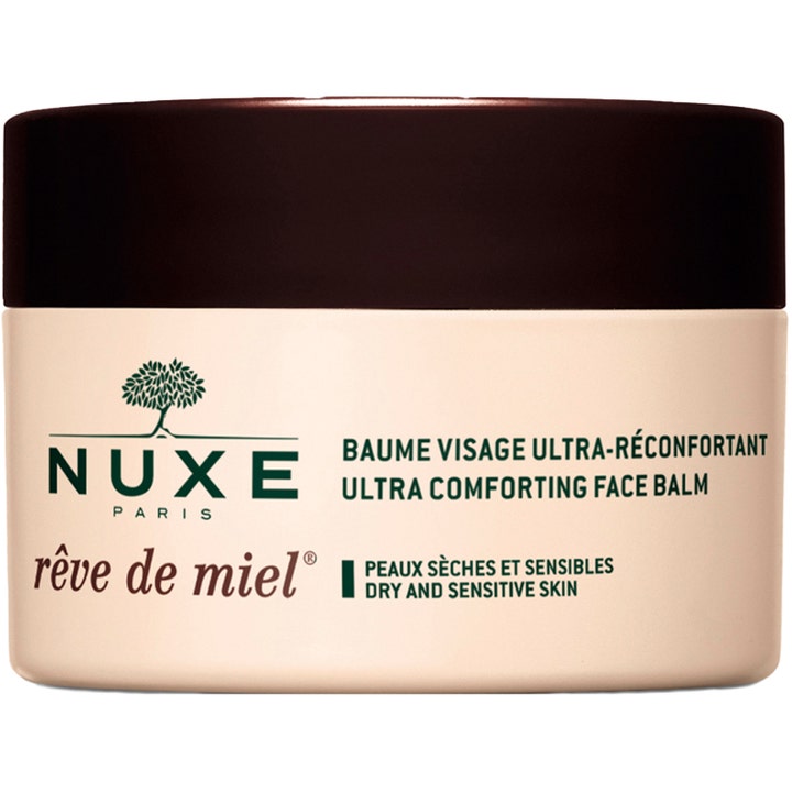 Nuxe Rêve de Miel Ultra Comforting Face Balm ravitseva kasvovoide kuivalle iholle beigessä purkissa tummalla korkilla.