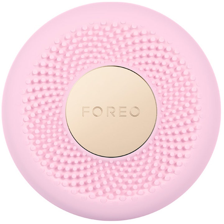 Foreo UFO kasvonaamiolaite syväkosteuttaa ihoa vaaleanpunainen pyöreä silikonilaite kultaisella logolevyllä