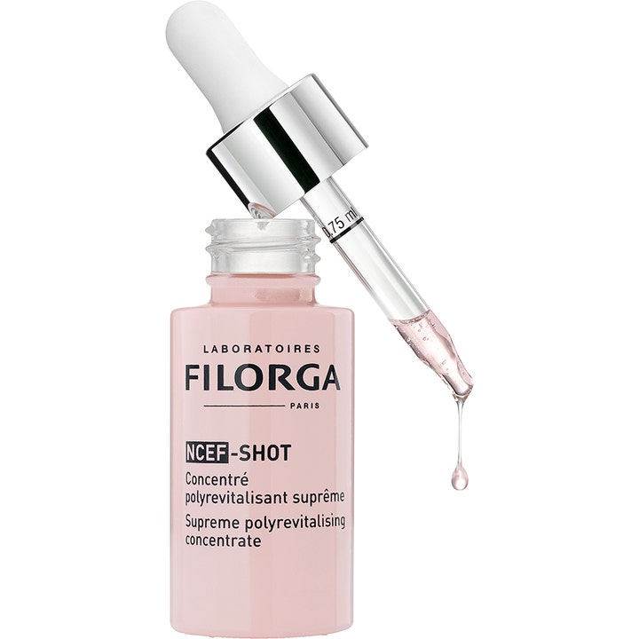 Filorga NCEF-Shot 15 ml elvyttävä seerumitiiviste vaaleanpunaisessa pullossa, pipetti ja nestemäinen tippa.