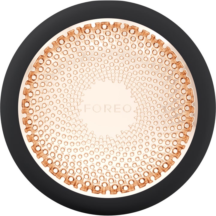 FOREO UFO 1 kpl kirkastava kasvohoitolaite antaa hehkua, musta runko ja ruusukultainen kuvioitu metallipinta.