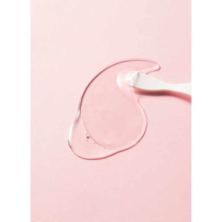 COSRX Peptide Collagen Hydrogel Eye patch 60 kpl kosteuttava silmänympäryslappu ja spaatteli vaaleanpunaisella taustalla.
