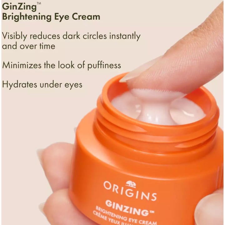 Origins GinZing Brightening Eye Cream kirkastava silmänympärysvoide oranssissa purkissa häivyttää tummia silmänalusia.