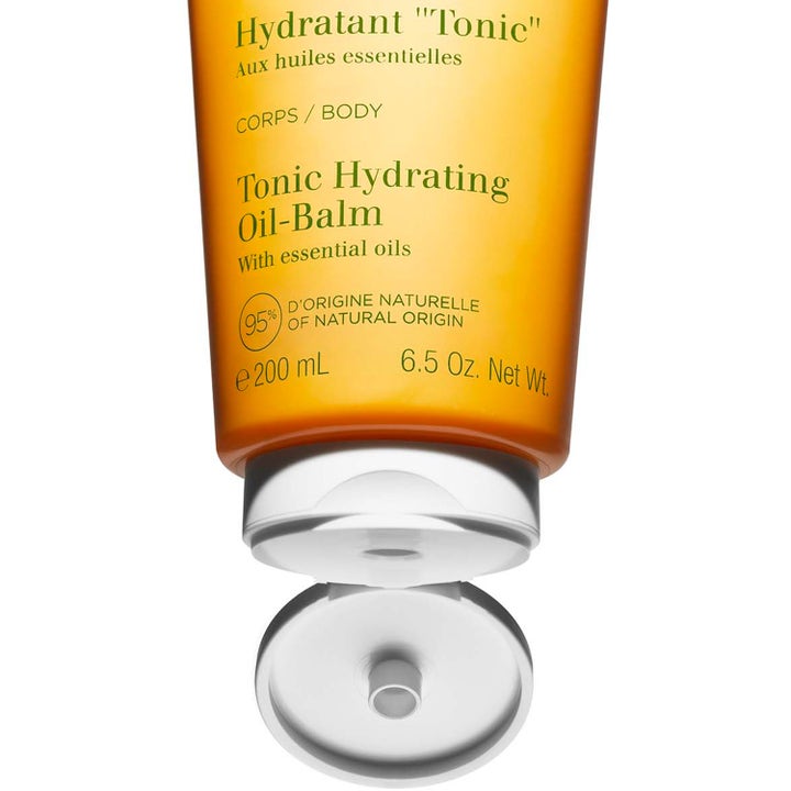 Clarins Tonic Hydrating Oil-Balm 200 ml kosteuttava vartalovoide oranssissa tuubissa valkoisella korkilla.