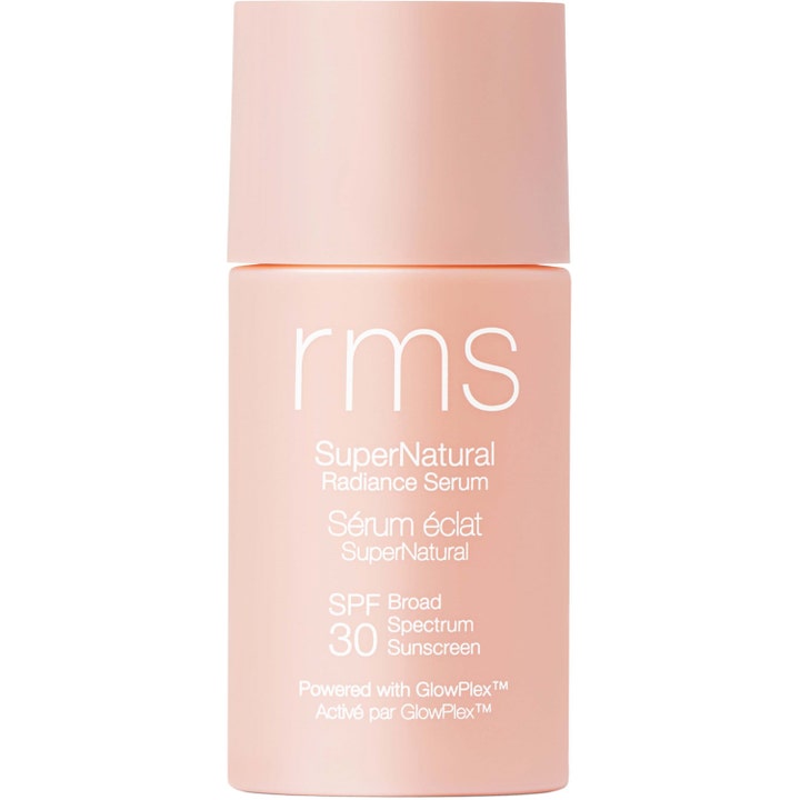 RMS Beauty SuperNatural Radiance Serum SPF 30 heleyttävä aurinkosuojaseerumi persikanvärisessä mattapullossa.