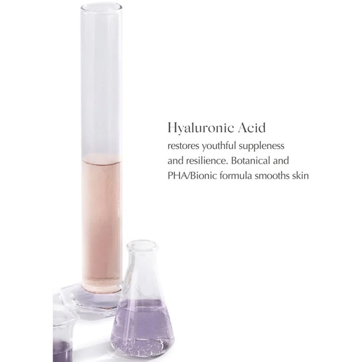 Exuviance HydraSoothe Refresh Toner 200 ml silottava kasvovesi kuvattuna laboratoriolasien ja PHA-tekstin kanssa.