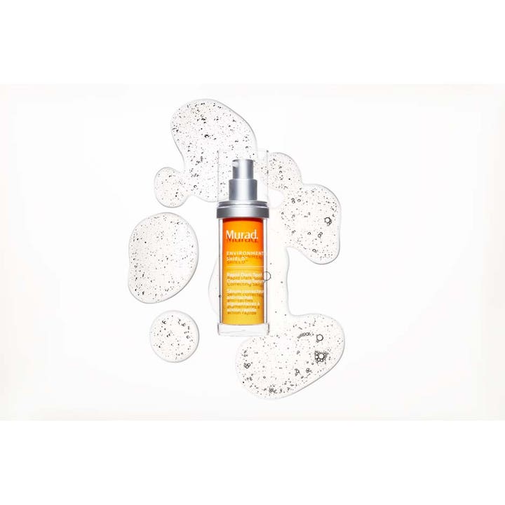 Murad Environmental Shield Rapid Dark Spot Correcting Serum 30 ml kirkastava seerumi oranssissa pullossa ja kirkas tekstuuri