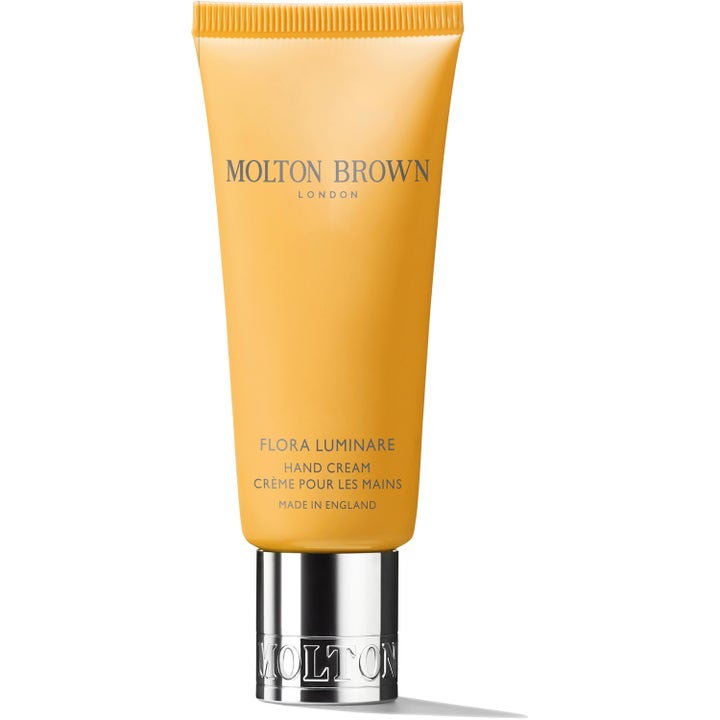 Molton Brown Flora Luminare 40 ml kosteuttava käsivoide keltaisessa tuubissa hopeanvärisellä korkilla
