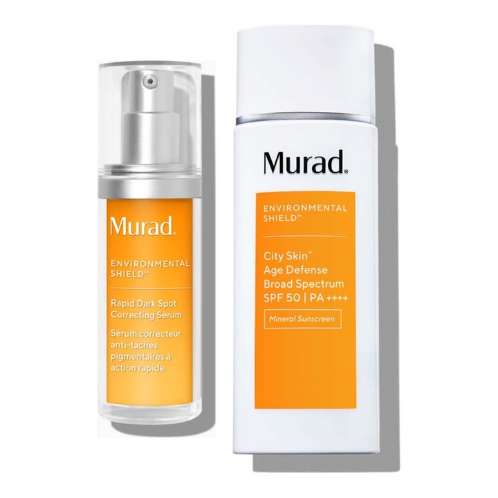 Murad Environmental Shield pigmenttiläiskiä häivyttävä seerumi ja SPF 50 -voide kirkkaissa oransseissa pulloissa.
