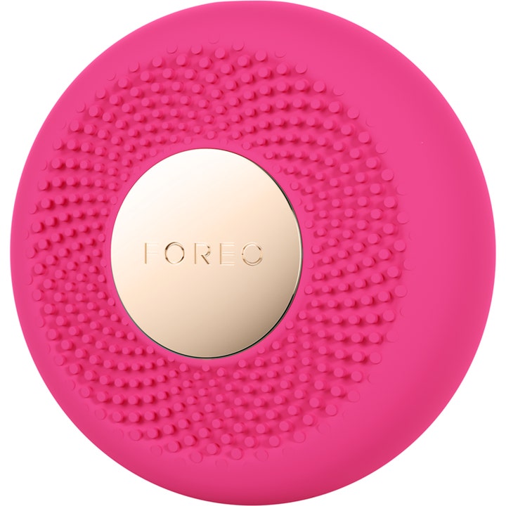 FOREO UFO™ 3 LED Pink 1 kpl kirkastava kasvohoitolaite on pyöreä vaaleanpunainen laite nystyräisellä silikonipinnalla.