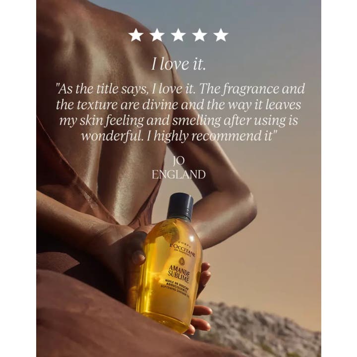 L'Occitane Almond Shower Oil 250 ml pehmentävä suihkuöljy ja asiakasarvostelu rannikkomaisemassa.