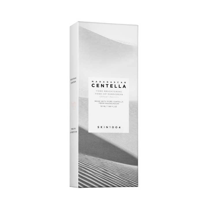 SKIN1004 Madagascar Centella Tone Brightening Tone-Up Sunscreen 50 ml suojakerroin SPF50+ valkoisessa pahvipakkauksessa.
