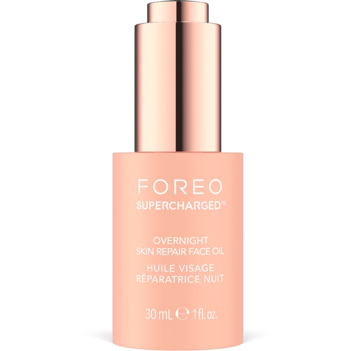 Foreo Supercharged Overnight Skin Repair Face Oil 30 ml korjaava kasvoöljy persikanvärisessä pullossa ruusukultaisella korkilla.