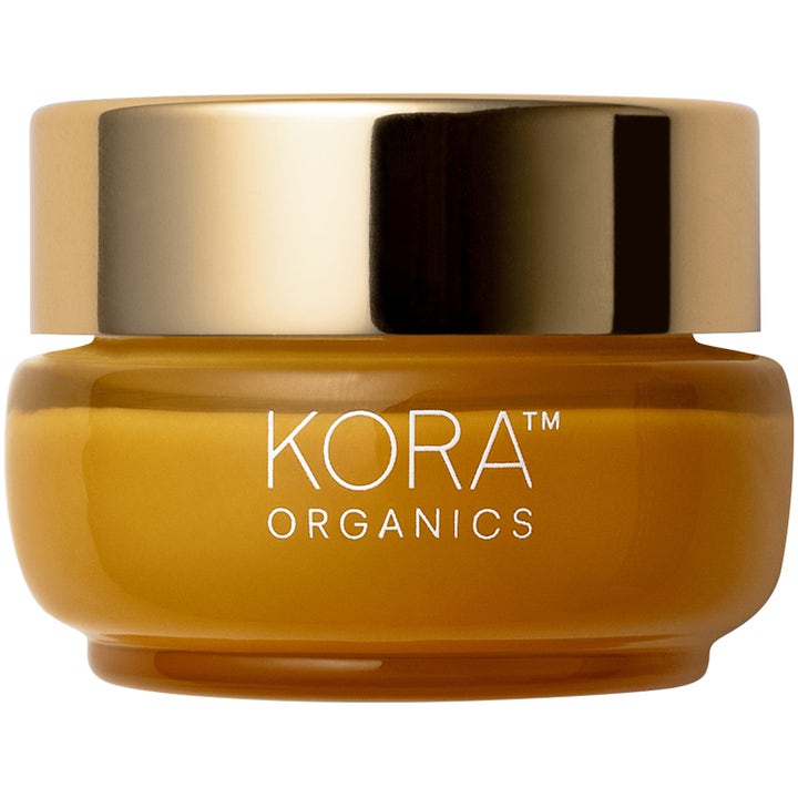 KORA Organics Turmeric Glow Moisturizer heleyttävä kasvovoide keltaisessa lasipurkissa kultaisella kannella