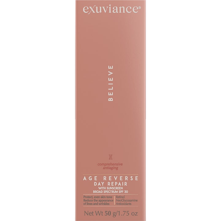 Exuviance Age Reverse Day Repair SPF30 50 g uudistava päivävoide tyylikkäässä vaaleanpunaisessa pakkauksessa