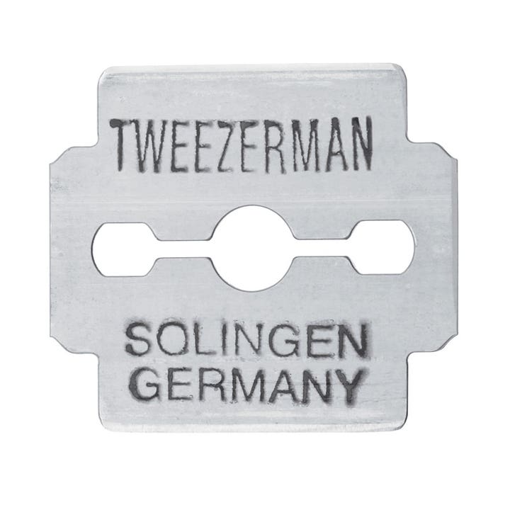 Tweezerman Callus Shaver Blades 20 kpl jalkojen hoitoon on hopeinen metalliterä jossa lukee Solingen Germany.