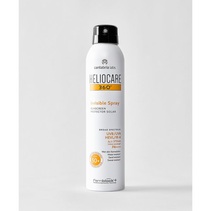 Heliocare Invisible Spray 200 ml SPF 50+ aurinkosuoja vartalolle valkoisessa suihkepullossa mustalla korkilla