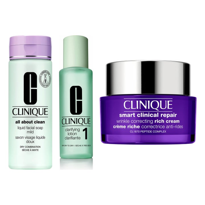Clinique Smart Clinical Repair ihonhoitosetti silottava voide violetissa purkissa sekä puhdistavat ihoemulsiot.
