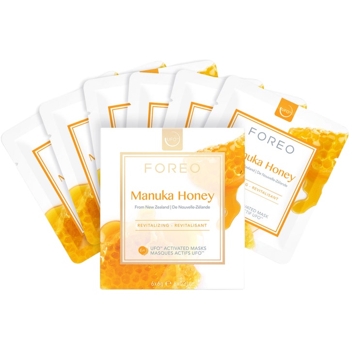 FOREO UFO Mask Manuka Honey 6 kpl elvyttävä kasvonaamio valkoisissa pakkauksissa hunajakuvioilla.