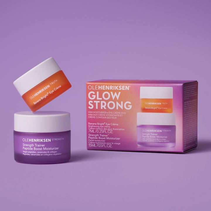 Ole Henriksen Glow Strong 22 ml ihonhoitosetti sisältää kaksi voidetta liilassa ja oranssissa purkissa.