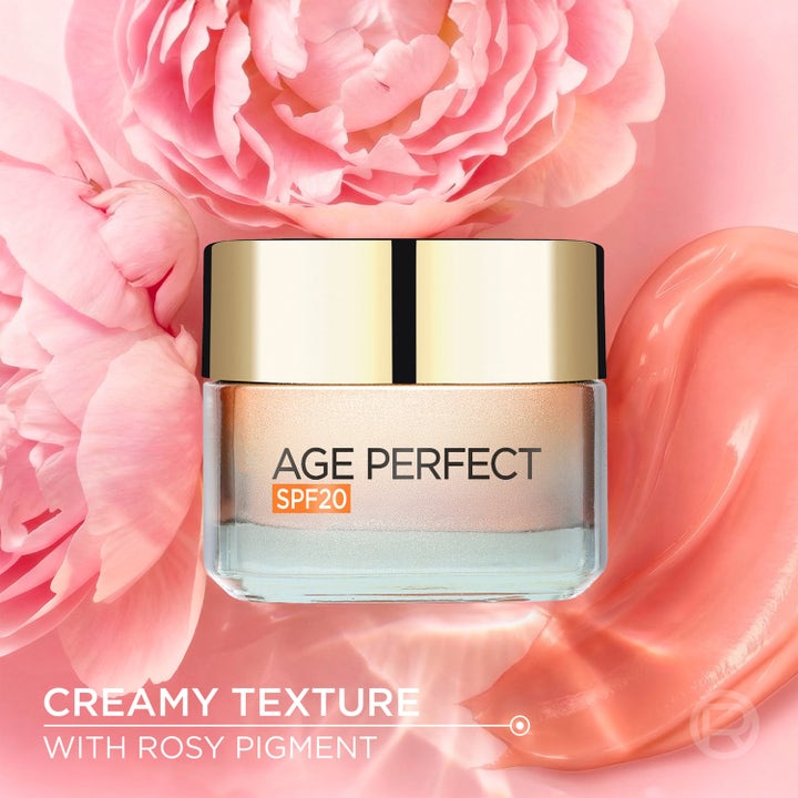 L'Oréal Paris Age Perfect Golden Age 50 ml päivävoide SPF20 vaaleanpunaisella voidetextuurilla ja kukkasilla.