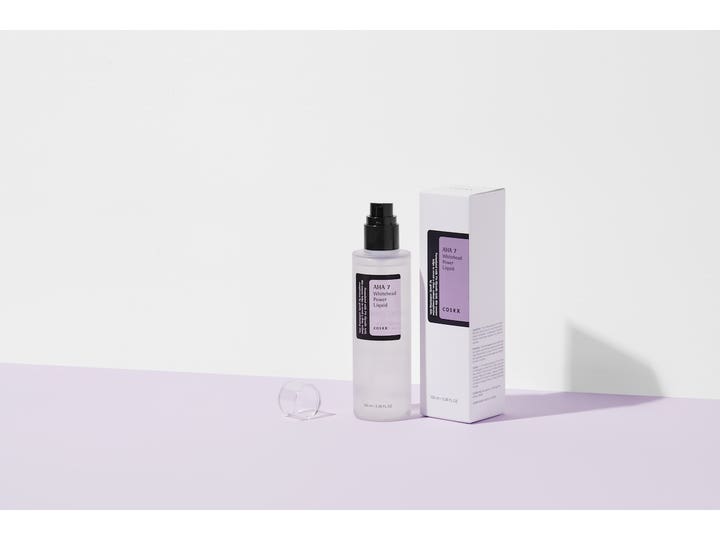 COSRX AHA 7 Whitehead Power Liquid 100 ml kirkastava kuorinta läpikuultavassa pumppupullossa ja pakkauksessa.