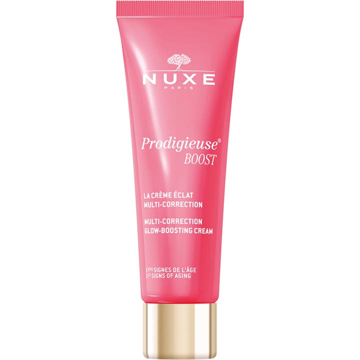 Nuxe Prodigieuse Boost Glow-Boosting Cream heleyttävä kasvovoide vaaleanpunaisessa tuubissa kultaisella korkilla