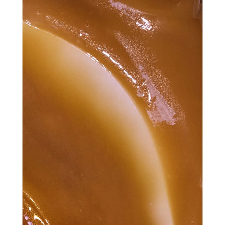 Rudolph Care Firming Eye Mask 20 ml silmänympärysnaamio, jossa on täyteläinen ja kiiltävä ruskea koostumus.