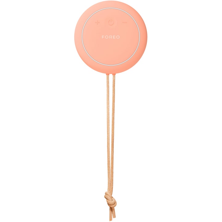 FOREO LUNA 4 body Peach Perfect 1 kpl syväpuhdistava vartaloharja on pyöreä persikanvärinen silikoninen kauneuslaite.