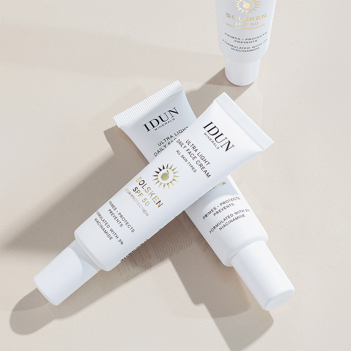 IDUN Minerals Solsken SPF50 30 ml suojaava kasvovoide niasiiniamidilla kolmessa valkoisessa tuubissa.