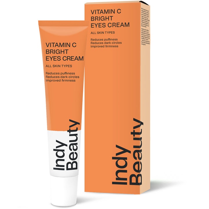 Indy Beauty Vitamin C Bright Eyes Cream 15 ml kirkastava silmänympärysvoide vähentää tummia silmänalusia oranssissa tuubissa.