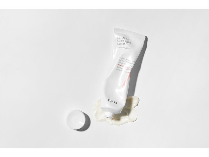 COSRX Balancium Comfort Ceramide Cream 80 ml rauhoittava kasvovoide valkoisessa tuubissa ja täyteläinen voide.