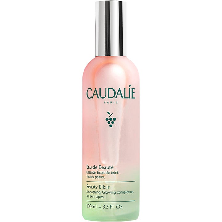 Caudalie Beauty Elixir 100 ml heleyttävä ja ihoa tasoittava kasvosuihke huurteisessa lasipullossa jossa on hopeakorkki