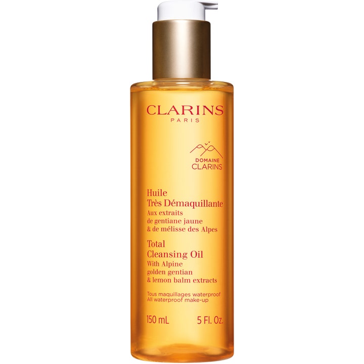 Clarins Total Cleansing Oil 150 ml puhdistusöljy poistaa vedenkestävän meikin oranssissa läpinäkyvässä pullossa.