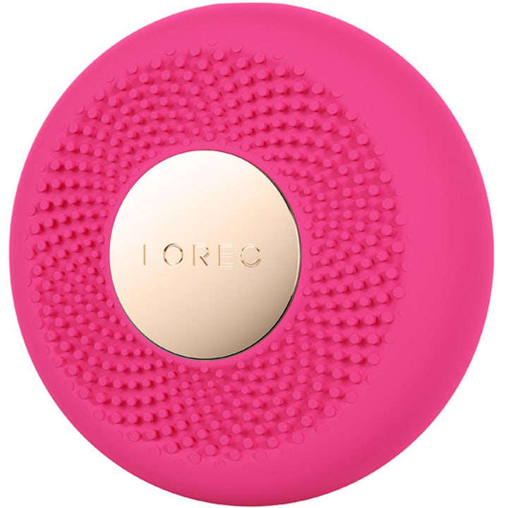 FOREO UFO 3 mini Fuchsia 1 kpl kosteuttava ihonhoitolaite on pyöreä fuksianpunainen nystyräpinnalla ja kultaisella levyllä
