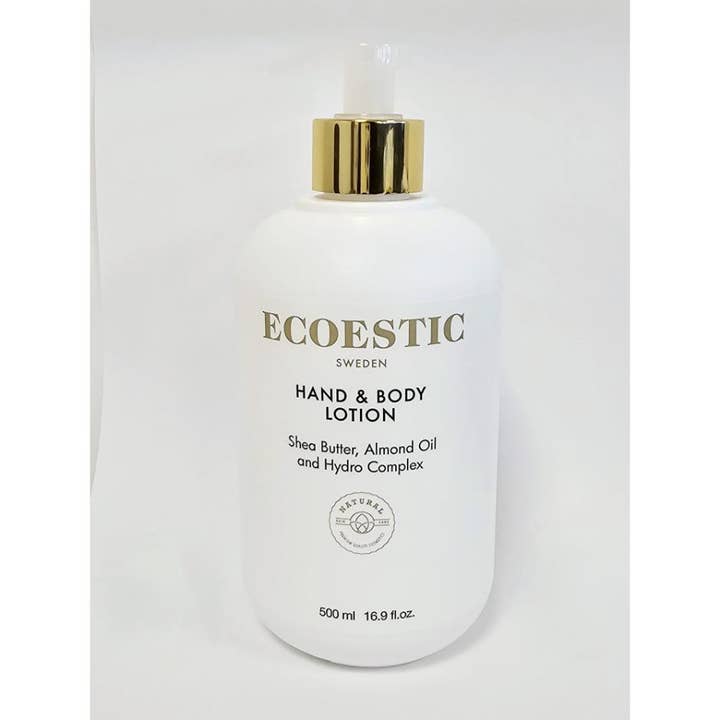 Ecoestic Hand & Body Lotion 500 ml kosteuttava vartalovoide valkoisessa pumppupullossa ylellisellä kultaisella korkilla