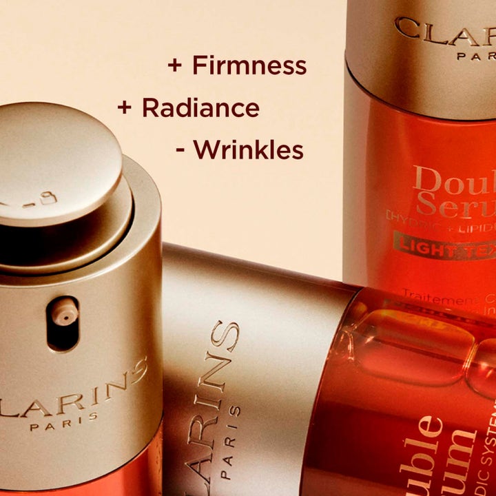 Clarins Double Serum Light Texture 50 ml kiinteyttävä seerumi kultaisessa pullossa tekstit + Firmness ja + Radiance.