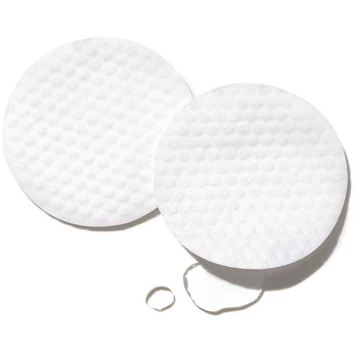 Exuviance Peeling Power kirkastava happokuorinta kaksi valkoista pintakuvioitua lappua ja kirkasta nestettä