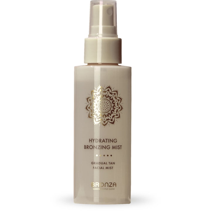 Bronza Hydrating Bronzing Mist 100 ml päivetystä syventävä kasvosuihke vaaleassa suihkepullossa kultaisella kuviolla